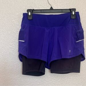 Athleta side pockets built in shorts running gym yoga work out Size XS